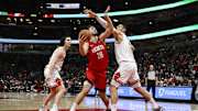 Nov 17, 2024; Chicago, Illinois, USA;  Houston Rockets center Alperen Sengun (28) drives to the basket against Chicago Bulls center Nikola Vucevic (9) and guard Josh Giddey (3) during the first half at United Center. Mandatory Credit: Matt Marton-Imagn Images