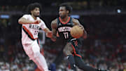 Nov 14, 2025; Houston, Texas, USA;  Houston Rockets forward Tari Eason (17) drives with the ball as Portland Trail Blazers guard Shaedon Sharpe (17) defends during the second quarter at Toyota Center. Mandatory Credit: Troy Taormina-Imagn Images