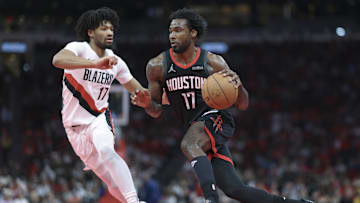 Nov 14, 2025; Houston, Texas, USA;  Houston Rockets forward Tari Eason (17) drives with the ball as Portland Trail Blazers guard Shaedon Sharpe (17) defends during the second quarter at Toyota Center. Mandatory Credit: Troy Taormina-Imagn Images