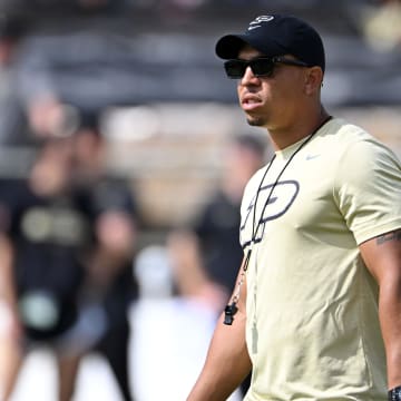 Purdue Boilermakers head coach Ryan Walters stands on the field 