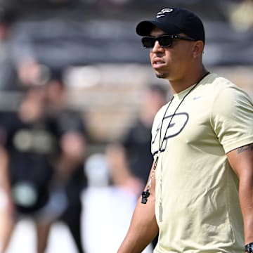 Purdue Boilermakers head coach Ryan Walters stands on the field 