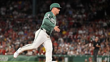 May 16, 2025; Boston, Massachusetts, USA; Boston Red Sox third base Alex Bregman (2) scores on a RBI single by shortstop Trevor Story (not pictured) during the ninth inning against the Atlanta Braves at Fenway Park. Mandatory Credit: Eric Canha-Imagn Images