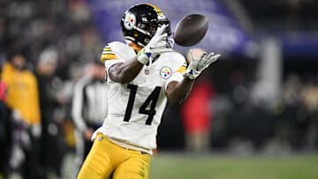 Jan 11, 2025; Baltimore, Maryland, USA; Pittsburgh Steelers wide receiver George Pickens (14) makes a catch against the Baltimore Ravens in the third quarter in an AFC wild card game at M&T Bank Stadium. Mandatory Credit: Tommy Gilligan-Imagn Images