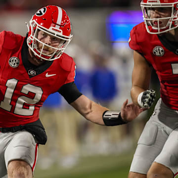 Oct 7, 2023; Athens, Georgia, USA; Georgia Bulldogs quarterback Brock Vandagriff (12) runs against the Kentucky Wildcats during the second half at Sanford Stadium. Mandatory Credit: Dale Zanine-Imagn Images