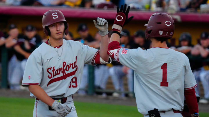 Jake Sapien (39) of Stanford celebrates a home run with teammate Owen Cobb (1) against Arizona State University at Phoenix Municipal Stadium on May 6, 2023.