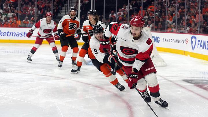 May 9, 2026; Philadelphia, Pennsylvania, USA; Carolina Hurricanes center Sebastian Aho (20) skates with the puck as Philadelphia Flyers defense Jamie Drysdale (9) defends in game four of the second round of the 2026 Stanley Cup Playoffs at Xfinity Mobile Arena. Mandatory Credit: James Lang-Imagn Images