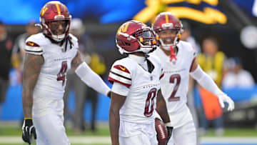 Oct 5, 2025; Inglewood, California, USA; Washington Commanders cornerback Mike Sainristil (0) celebrates after intercepting the ball against the Los Angeles Chargers in the second half at SoFi Stadium. 