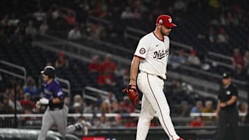 Jun 18, 2025; Washington, District of Columbia, USA; Washington Nationals starting pitcher Mitchell Parker (70) reacts after giving up a solo home run to Colorado Rockies first baseman Michael Toglia (4) during the sixth inning at Nationals Park. 