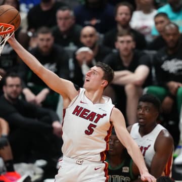 Apr 27, 2024; Miami, Florida, USA; Miami Heat forward Nikola Jovic (5) drives to the basket against the Boston Celtics in the second half during game three of the first round for the 2024 NBA playoffs at Kaseya Center. Mandatory Credit: Jim Rassol-USA TODAY Sports