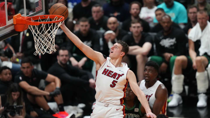 Apr 27, 2024; Miami, Florida, USA; Miami Heat forward Nikola Jovic (5) drives to the basket against the Boston Celtics in the second half during game three of the first round for the 2024 NBA playoffs at Kaseya Center. Mandatory Credit: Jim Rassol-USA TODAY Sports