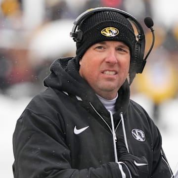 Nov 30, 2024; Columbia, Missouri, USA; Missouri Tigers head coach Eli Drinkwitz watches play against the Arkansas Razorbacks during the first half at Faurot Field at Memorial Stadium. Mandatory Credit: Denny Medley-Imagn Images