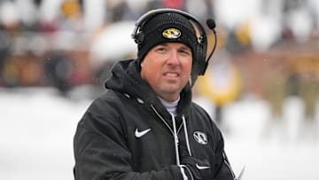 Nov 30, 2024; Columbia, Missouri, USA; Missouri Tigers head coach Eli Drinkwitz watches play against the Arkansas Razorbacks during the first half at Faurot Field at Memorial Stadium. Mandatory Credit: Denny Medley-Imagn Images