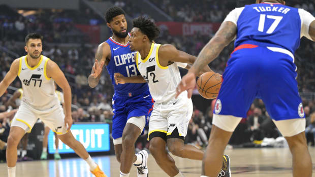 Apr 5, 2024; Los Angeles, California, USA; Utah Jazz guard Collin Sexton (2) is defended by Los Angeles Clippers forward Paul