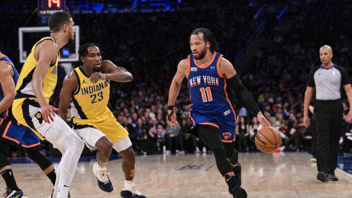 Feb 10, 2024; New York, New York, USA; New York Knicks guard Jalen Brunson (11) dribbles while being defended by Indiana Pacers forward Aaron Nesmith (23) and Indiana Pacers guard Tyrese Haliburton (0) during the third quarter at Madison Square Garden. Mandatory Credit: John Jones-USA TODAY Sports