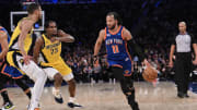 Feb 10, 2024; New York, New York, USA; New York Knicks guard Jalen Brunson (11) dribbles while being guarded by Tyrese Haliburton (0) and Aaron Nesmith (23) of the Indiana Pacers.
