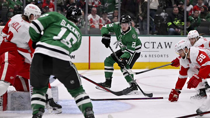 Jan 19, 2025; Dallas, Texas, USA; Dallas Stars center Colin Blackwell (15) passes the puck to right wing Matej Blumel (25) during the second period against the Detroit Red Wings at the American Airlines Center. Mandatory Credit: Jerome Miron-Imagn Images