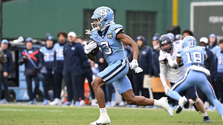 Dec 28, 2024; Boston, MA, USA; North Carolina Tar Heels wide receiver Chris Culliver (3) returns a kick for a touchdown against the Connecticut Huskies during the first half at Fenway Park. Mandatory Credit: Eric Canha-Imagn Images