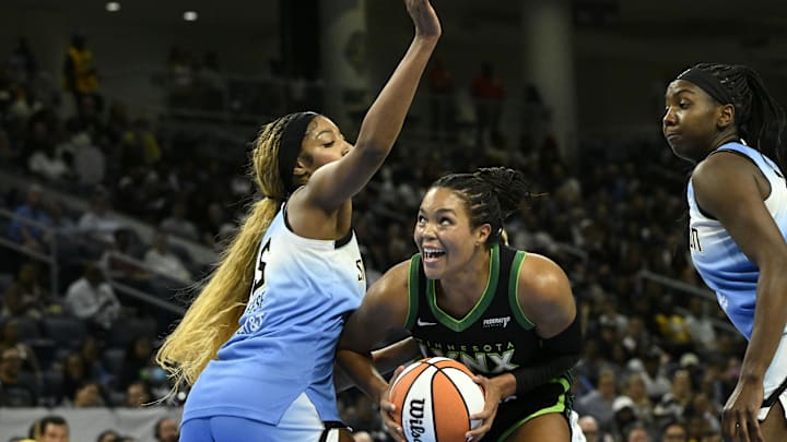 Jul 14, 2025; Chicago, Illinois, USA;  Minnesota Lynx forward Napheesa Collier (24) drives to the basket against Chicago Sky forward Angel Reese (5)  during the first half at Wintrust Arena. Mandatory Credit: Matt Marton-Imagn Images