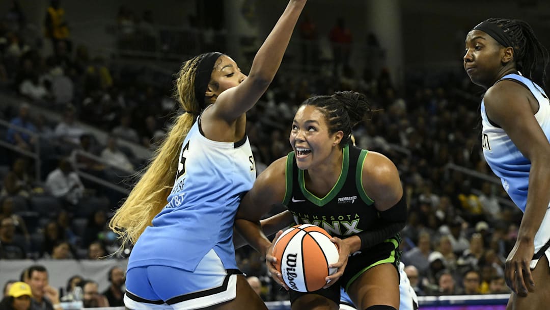Jul 14, 2025; Chicago, Illinois, USA;  Minnesota Lynx forward Napheesa Collier (24) drives to the basket against Chicago Sky forward Angel Reese (5)  during the first half at Wintrust Arena. Mandatory Credit: Matt Marton-Imagn Images
