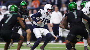 Penn State football quarterback Drew Allar (15) runs for a gain against the Oregon Ducks during the 2024 Big Ten Championship Game