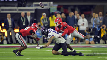 TCU Horned Frogs tight end Jared Wiley (19) cannot catch a pass against Georgia Bulldogs defensive back Kelee Ringo (5) and defensive back David Daniel-Sisavanh (14) in the first half in the CFP national championship game at SoFi Stadium