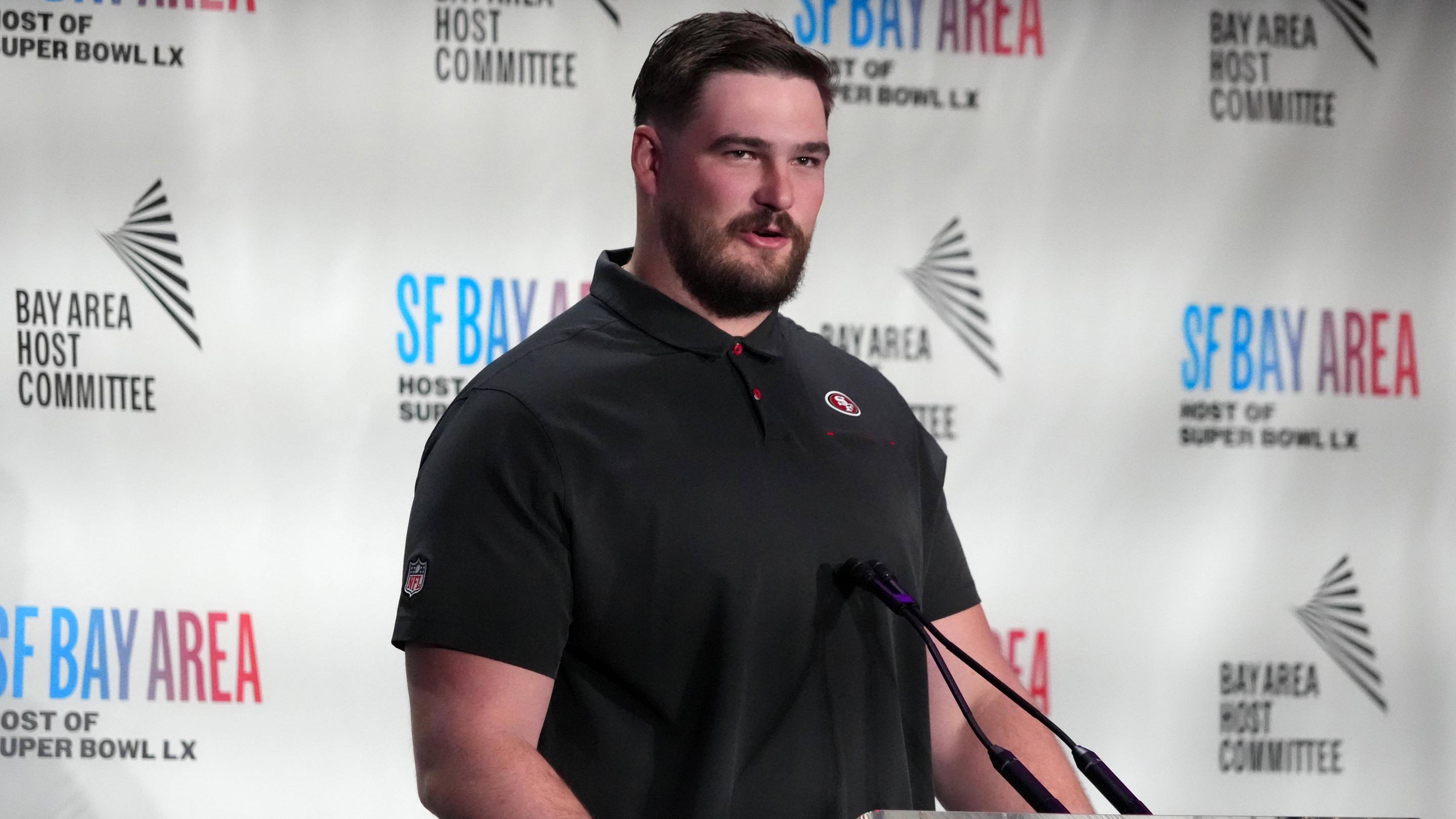 Feb 2, 2026; San Francisco, CA, USA; San Francisco 49ers lineman Colton McKivitz speaks during the Bay Area host committee press conference at the Super Bowl LX media center at the Moscone Center. Mandatory Credit: Kirby Lee-Imagn Images