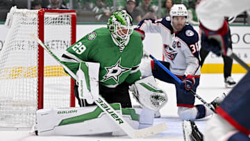 Oct 21, 2025; Dallas, Texas, USA; Columbus Blue Jackets center Boone Jenner (38) scores a power play goal against Dallas Stars goaltender Jake Oettinger (29) during the first period at the American Airlines Center. Mandatory Credit: Jerome Miron-Imagn Images