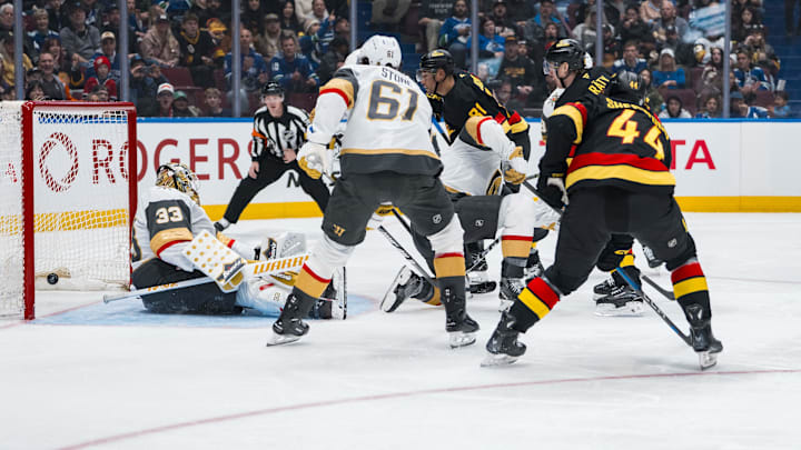Apr 6, 2025; Vancouver, British Columbia, CAN; Vegas Golden Knights forward Mark Stone (61) and Vancouver Canucks forward Kiefer Sherwood (44) watch as forward Aatu Raty (54) scores on goalie Adin Hill (33) in the second period at Rogers Arena. Mandatory Credit: Bob Frid-Imagn Images