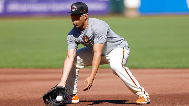 Jun 11, 2024; San Francisco, California, USA; San Francisco Giants infielder LaMonte Wade Jr. (31) fields a ground ball during warmups before the game against the Houston Astros at Oracle Park.