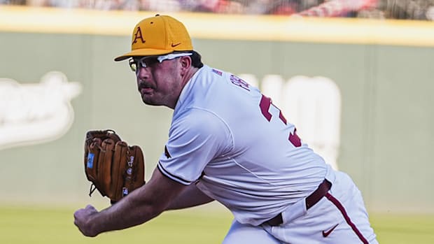 Arkansas starter Colin Fisher throws a pitch 