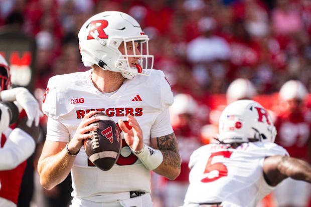 Rutgers Scarlet Knights quarterback Athan Kaliakmanis (16) drops back to pass.
