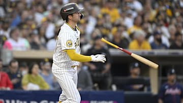 Oct 2, 2024; San Diego, California, USA; San Diego Padres catcher Kyle Higashioka (20) hits a solo home run during the second inning of game two in the Wildcard round for the 2024 MLB Playoffs against the Atlanta Braves at Petco Park. Mandatory Credit: Denis Poroy-Imagn Images
