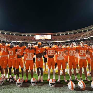 Tennessee players listen to the Tennessee Waltz after a game between Tennessee and Kent State at Neyland Stadium, in Knoxville, Tenn., Saturday, Sept. 14, 2024. Tennessee defeated Ken State 71-0.