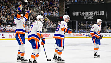 Jan 11, 2025; Salt Lake City, Utah, USA; New York Islanders left wing Anders Lee (27) celebrates with defenseman Adam Pelech (3), center Brock Nelson (29), and defenseman Ryan Pulock (6) after a goal against the Utah Hockey Club during third period at the Delta Center. Mandatory Credit: Christopher Creveling-Imagn Images