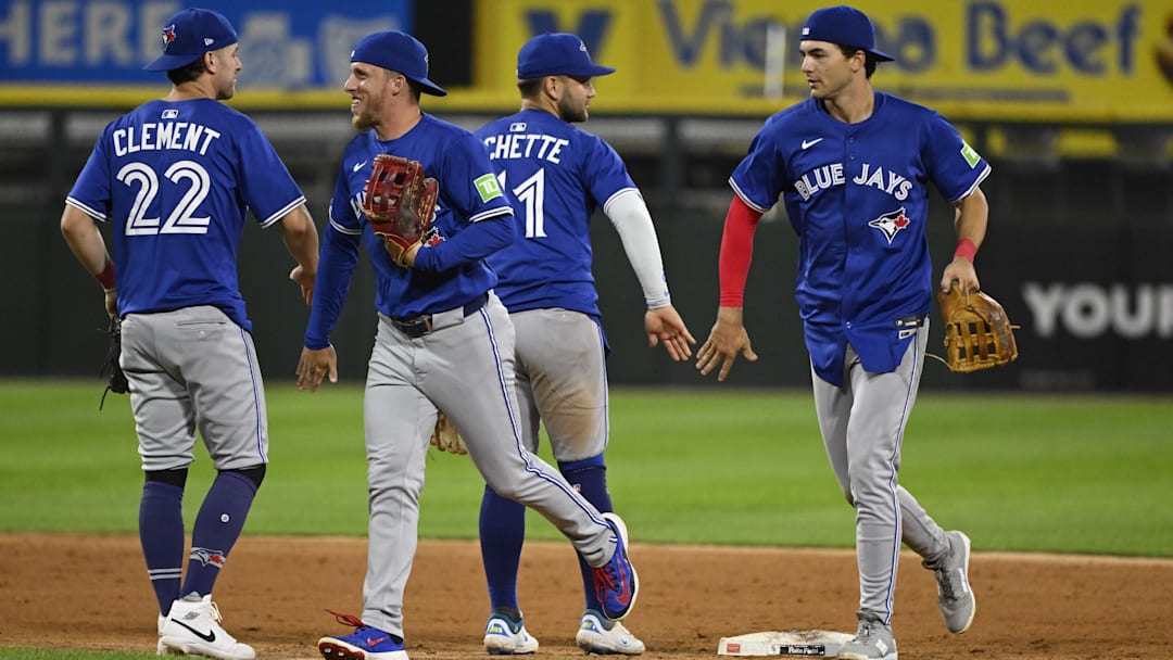 Jul 7, 2025; Chicago, Illinois, USA;  Toronto Blue Jays third baseman Ernie Clement (22), outfielder Myles Straw (3),  shortstop Bo Bichette (11) and outfielder Joey Loperfido (10) after the game against the Chicago White Sox at Rate Field. Mandatory Credit: Matt Marton-Imagn Images