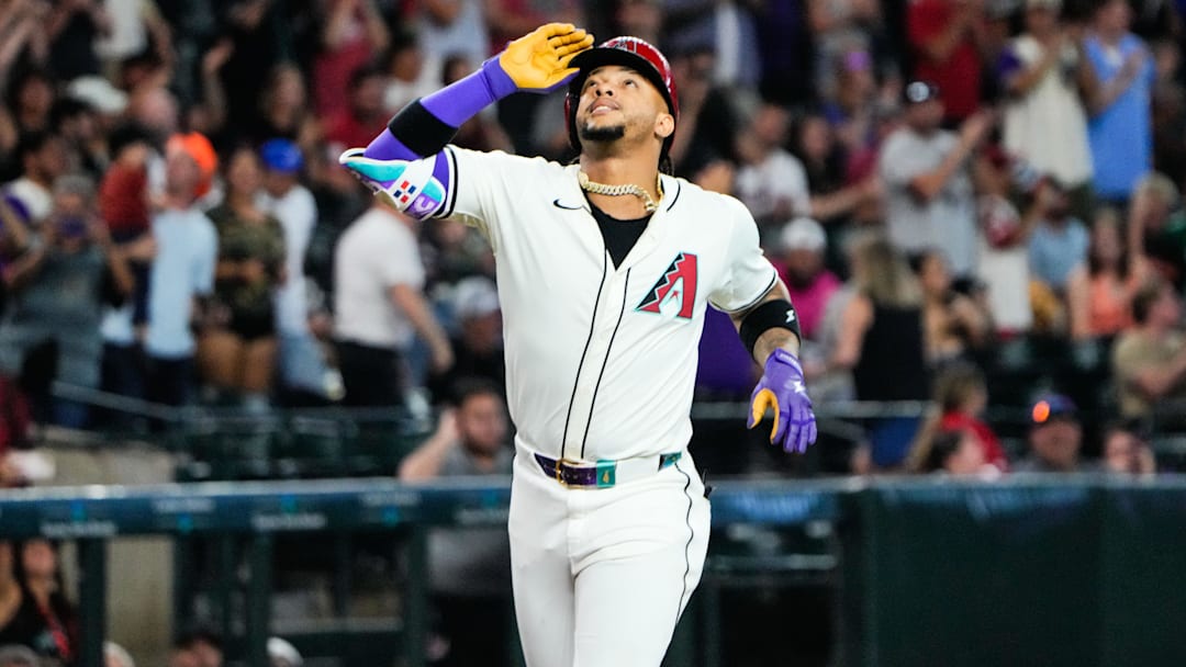 Jun 28, 2025; Phoenix, Arizona, USA; Arizona Diamondbacks second baseman Ketel Marte (4) reacts at home plate after hitting a three-run home run in the fourth inning against the Miami Marlins at Chase Field. Mandatory Credit: Arianna Grainey-Imagn Images
