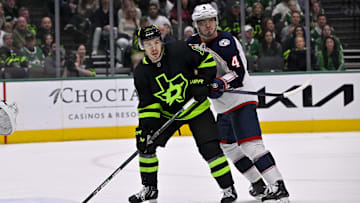 Feb 2, 2025; Dallas, Texas, USA; Dallas Stars center Logan Stankoven (11) and Columbus Blue Jackets center Cole Sillinger (4) in action during the game between the Dallas Stars and the Columbus Blue Jackets at American Airlines Center. Mandatory Credit: Jerome Miron-Imagn Images