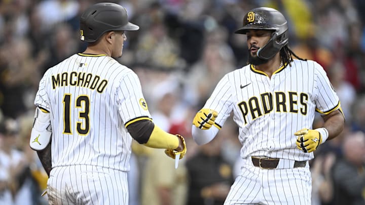 Jul 10, 2025; San Diego, California, USA; San Diego Padres right fielder Fernando Tatis Jr. (23) is congratulated by Manny Machado (13) after hitting a solo home run during the third inning against the Arizona Diamondbacks at Petco Park. Mandatory Credit: Denis Poroy-Imagn Images a Jul 10, 2025; San Diego, California, USA; San Diego Padres right fielder Fernando Tatis Jr. (23) is congratulated by Manny Machado (13) after hitting a solo home run during the third inning against the Arizona Diamondbacks at Petco Park. Mandatory Credit: Denis Poroy-Imagn Images a