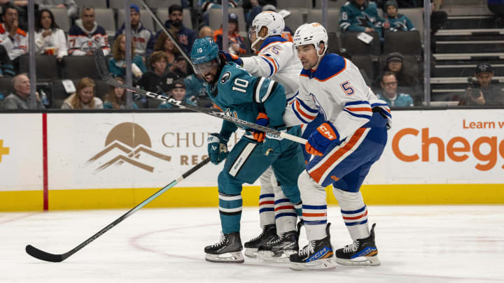 Nov 9, 2023; San Jose, California, USA; Edmonton Oilers defenseman Darnell Nurse (25) and Edmonton Oilers defenseman Cody Ceci (5) and San Jose Sharks left wing Anthony Duclair (10) battle for position in front of the net during the second period at SAP Center at San Jose. Mandatory Credit: Neville E. Guard-USA TODAY Sports