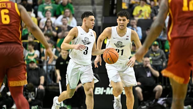 Mar 1, 2025; Eugene, Oregon, USA; Oregon Ducks guard Jackson Shelstad (3) brings the ball up court with forward Brandon Angel