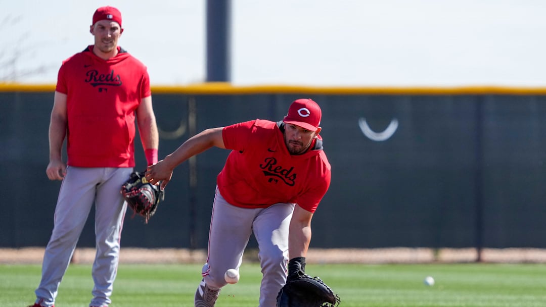Cincinnati Reds catcher Jose Trevino (35) fields a ground ball in a catchers drill at the Cincinnati Reds Player Development Complex in Goodyear, Ariz., on Friday, Feb. 14, 2025.