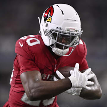 Nov 3, 2025; Arlington, Texas, USA; Arizona Cardinals running back Bam Knight (20) runs against the Dallas Cowboys in the first half at AT&T Stadium. Mandatory Credit: Jerome Miron-Imagn Images