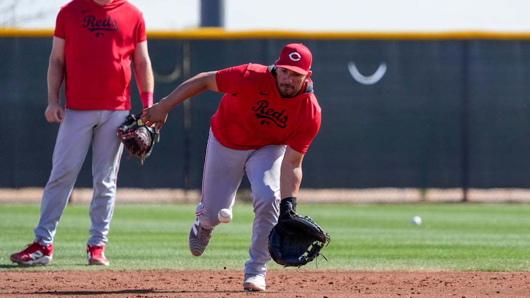 Cincinnati Reds catcher Jose Trevino (35) fields a ground ball in a catchers drill at the Cincinnati Reds Player Development Complex in Goodyear, Ariz., on Friday, Feb. 14, 2025.