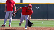 Cincinnati Reds catcher Jose Trevino (35) fields a ground ball in a catchers drill at the Cincinnati Reds Player Development Complex in Goodyear, Ariz., on Friday, Feb. 14, 2025.