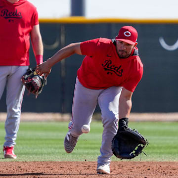 Cincinnati Reds catcher Jose Trevino (35) fields a ground ball in a catchers drill at the Cincinnati Reds Player Development Complex in Goodyear, Ariz., on Friday, Feb. 14, 2025.