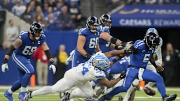 Nov 24, 2024; Indianapolis, Indiana, USA; Detroit Lions defensive tackle Alim McNeill (54) causes Indianapolis Colts quarterback Anthony Richardson (5) to fumble the ball during a game against the Detroit Lions  at Lucas Oil Stadium. Mandatory Credit: Christine Tannous/USA TODAY Network via Imagn Images