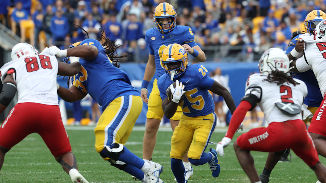 Oct 25, 2025; Pittsburgh, Pennsylvania, USA;  Pittsburgh Panthers running back Ja'Kyrian Turner (25) runs the ball against the North Carolina State Wolfpack during the first quarter at Acrisure Stadium. Mandatory Credit: Charles LeClaire-Imagn Images