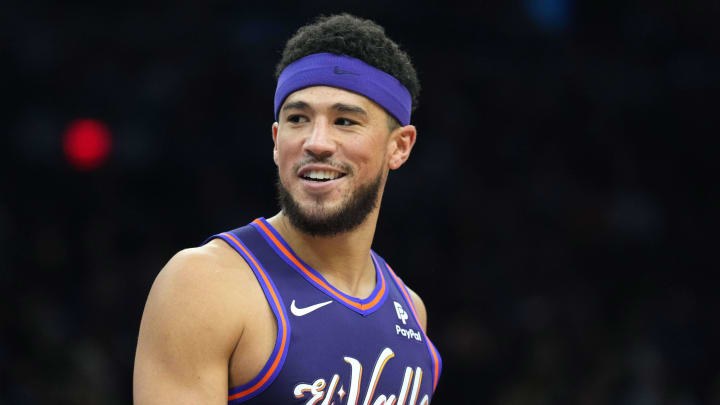 Dec 29, 2023; Phoenix, Arizona, USA; Phoenix Suns guard Devin Booker (1) looks on against the Charlotte Hornets during the first half at Footprint Center. Mandatory Credit: Joe Camporeale-USA TODAY Sports