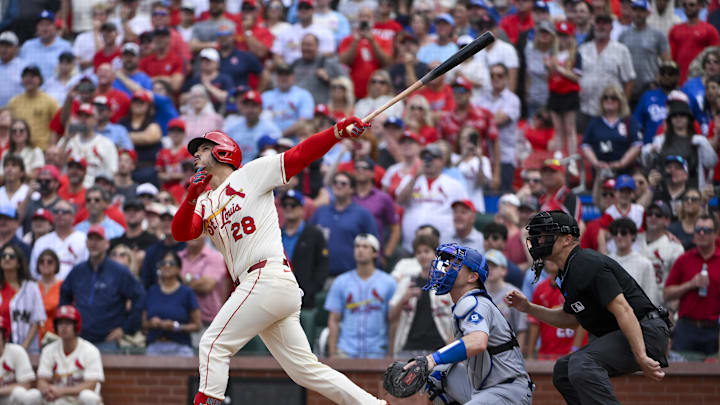Jun 7, 2025; St. Louis, Missouri, USA;  St. Louis Cardinals pinch hitter Nolan Arenado (28) hits a walk-off one run single against the Los Angeles Dodgers during the ninth inning at Busch Stadium. Mandatory Credit: Jeff Curry-Imagn Images