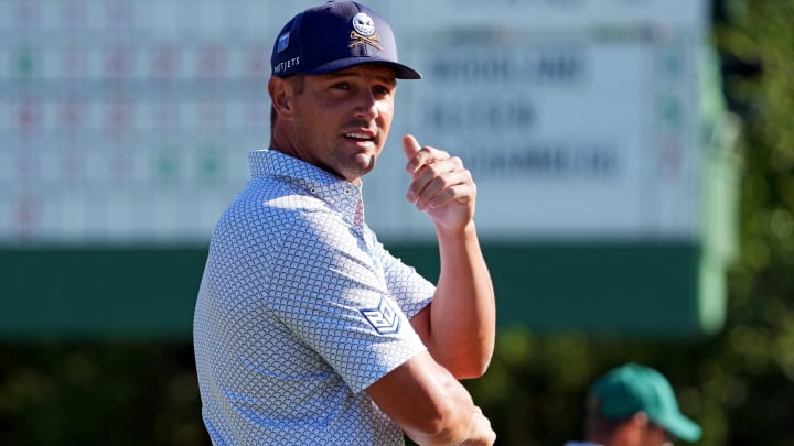 Apr 12, 2024; Augusta, Georgia, USA; Bryson DeChambeau waits to putt on the 18th green during the second round of the Masters. 